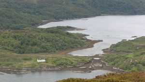 Doirlinn. House beside the tidal channel between the mainland and Oronsay. The building may be the former Inn and drovers' change-house. © Richard Webb, Geograph