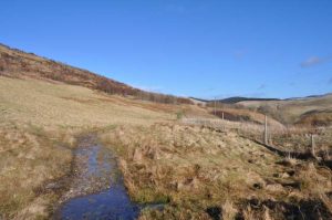 NN982036: looking NNE along the path which skirts the lower slopes of Glenquey Hill before descending into Glendevon (2015). © Robert Struthers, Geograph