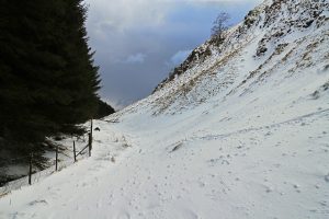 NN969013 looking SSW along the path which runs from Dollar to Glen Devon, here seen near Maiden's Well. This is the narrow section between the flanks of Hillfoot Hill and Whitewhisp Hill, covered by snow in March 2013. © William Starkey, Geograph