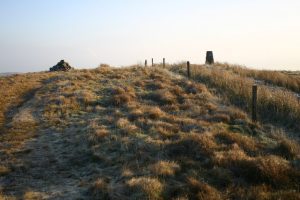 Looking east past the cairn and trig on Tomtain. © Iain Macaulay, Geograph