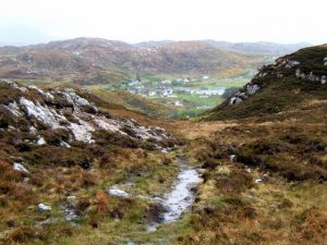 This is the start of the steep drop to Scourie. © AlastairG, Geograph