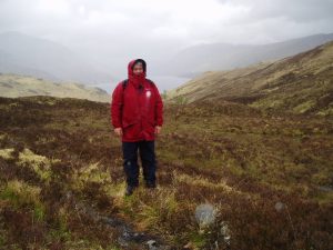 NN 315 676: rainswept in the heather! At the top of Gleann Iolairean, four miles from Corrour Station with Loch Treig in the background. © John Naisbitt, Geograph