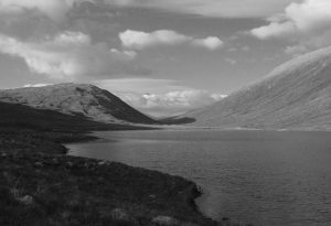 Loch Chiarain, a small loch between Beinn na Cloiche and Beinn a Bhric. Until about 50 years ago, someone lived here. I met once met the postman whose round took him up Glen Nevis and on to the railway at Corrour. © Richard Webb, Geograph