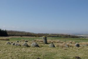 Stone Circle south of Old Military Road. A circle of 28 stones 50ft in diameter with the centre stone 6ft high. © Leslie Barrie, Geograph
