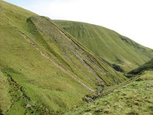 NS884094 looking south down the Enterkin Burn, with the western slope of Wether Hill in the foreground and that of Steygail beyond (2007). © Eileen Henderson, Geograph