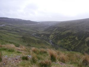 NH546059: Coire an Eich and hydro road. Coire an Eich comes up to near road as road goes down. Photo taken from high point of road looking SSE. © Sarah McGuire, Geograph