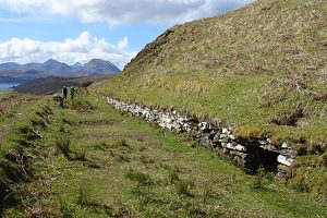 NG595362 looking SW (2018). A very well constructed track with a holding dyke along the uphill side. Looking at the six-inch map, there are several bench marks cut into the stones of the dyke between North Fearns and Gualainn na Leac. © Anne Burgess, Geograph