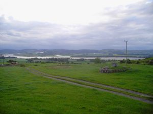 NO227167 looking northwest to the Tay, with ancient route and cross in the foreground (2009). © A A Lang, Geograph