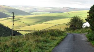 NT519579: looking south-southwest along the last public bit of the road over Lammer Law on the Berwickshire side. From here the road carries on as a well surfaced track to Gifford. The view is downhill towards Carfraemill. © Richard Webb, Geograph