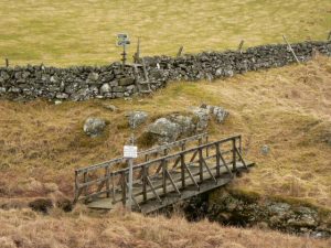 Looking north on the public footpath from Kirkmichael to Lair in Glenshee. The sign asks walkers to not to enter the area of Ashintully Castle. © Rob Burke, Geograph