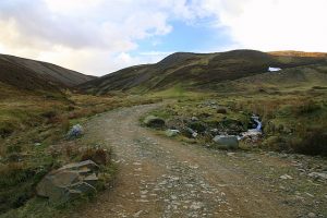 NO474655 looking N up Glen Cruik (2009). The shoulder of Bruff Shank is visible on the right. The Burn of Glenlick passes under the road to join Cruik Water. © Dan, Geograph
