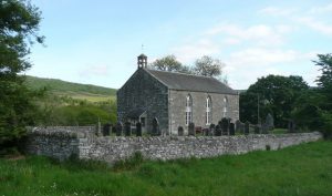 NN808653: Struan Kirk, prettily positioned beside the Errochty Water and the River Garry (2009). Built in 1828, it replaced a much earlier building which stood slightly to the south of the present church. © Russel Wills, Geograph