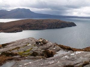 NC105011 looking SSW (2008). Cairn, Carn Dearg; marker on the coastal path. Note the splendid view of Isle Martin and Beinn Ghobhlach. © Chris Eilbeck, Geograph