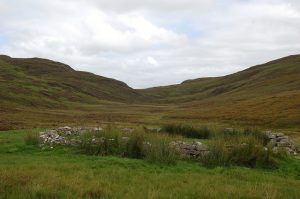 Sheepfold below the Bealach Easach. The path to Loch Choire can be seen slanting up the hillside on the left. © Jim Barton, Geograph