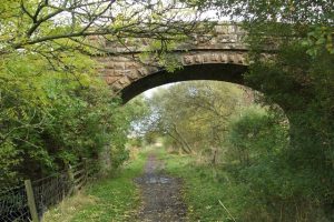 NS590787: looking east, through the bridge to Craigend Farm, on the Strathkelvin Railway Path (2005). The path has since been upgraded.