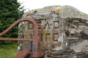 NT189351: Dead Wife's Grave perhaps relates to a wife or camp follower of Montrose's army slain here fleeing from the 1645 Battle of Philiphaugh. There are no other remains, but the southern gatepost in the wall dividing Dawyck and Manor commemorates her. © Jim Barton, Geograph