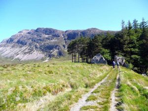 These two boulders were presumably once one - and split by the action of frost. They make a fine gateway at the start of the ascent of Arkle, seen in the background. © Gordon Brown, Geograph